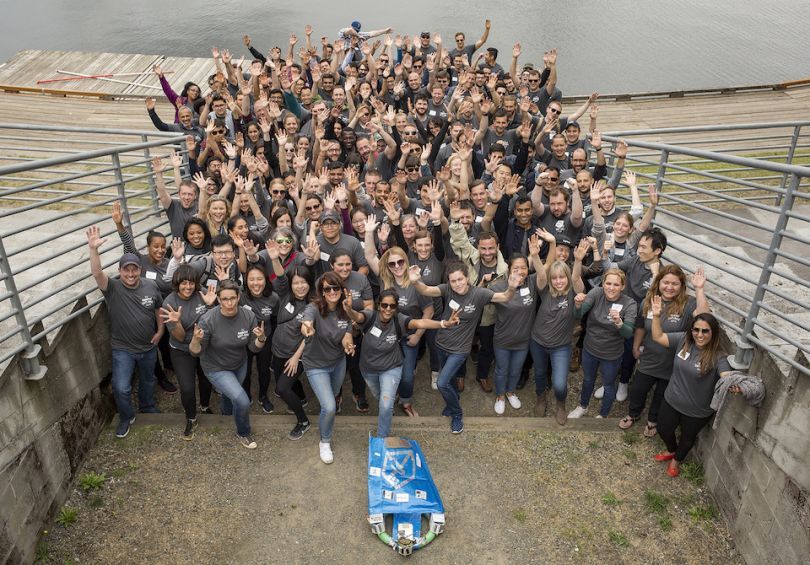 Big Remitly team photo outdoors by water