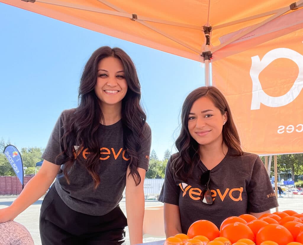 Veeva team members posing for picture at outdoor event